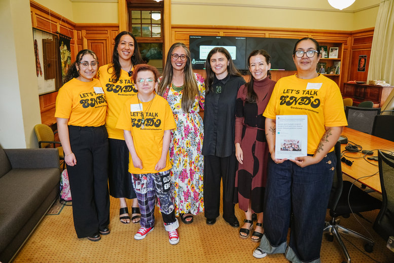The Endo Warriors Aotearoa team at Parliament wearing yellow Let's Talk Endo t-shirts